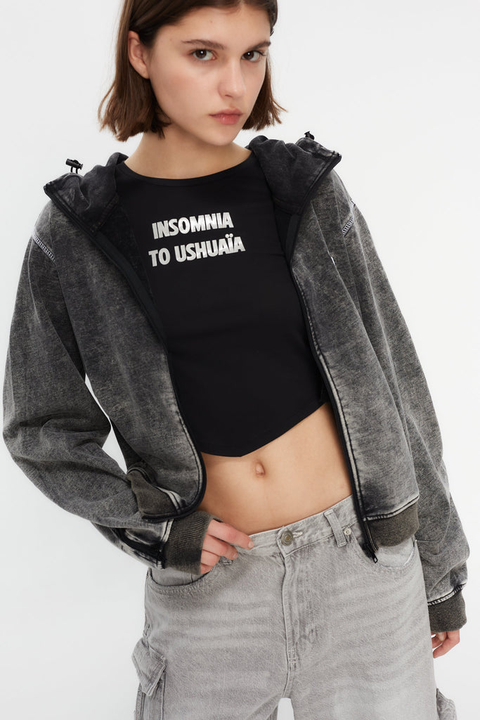 Hoodie with acid wash finish. Features a zipper running from sleeve to sleeve across the back, revealing a hidden print in white finish.