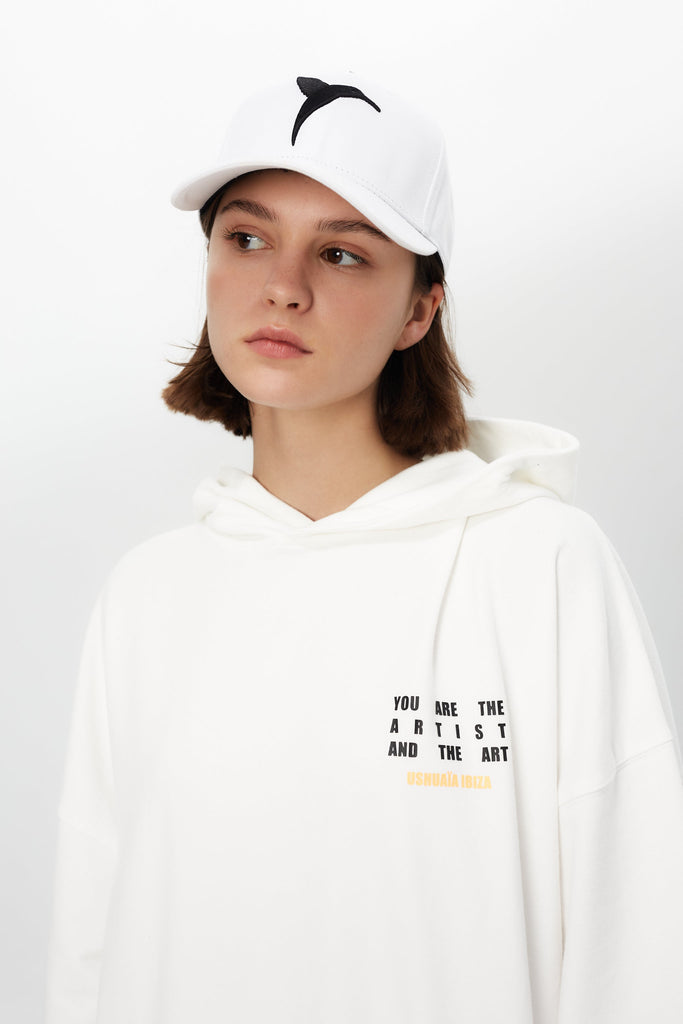 Oversized hoodie with bold graphic print for a trendy Ibiza streetwear look. Cozy & stylish for cool summer nights. Shop now!