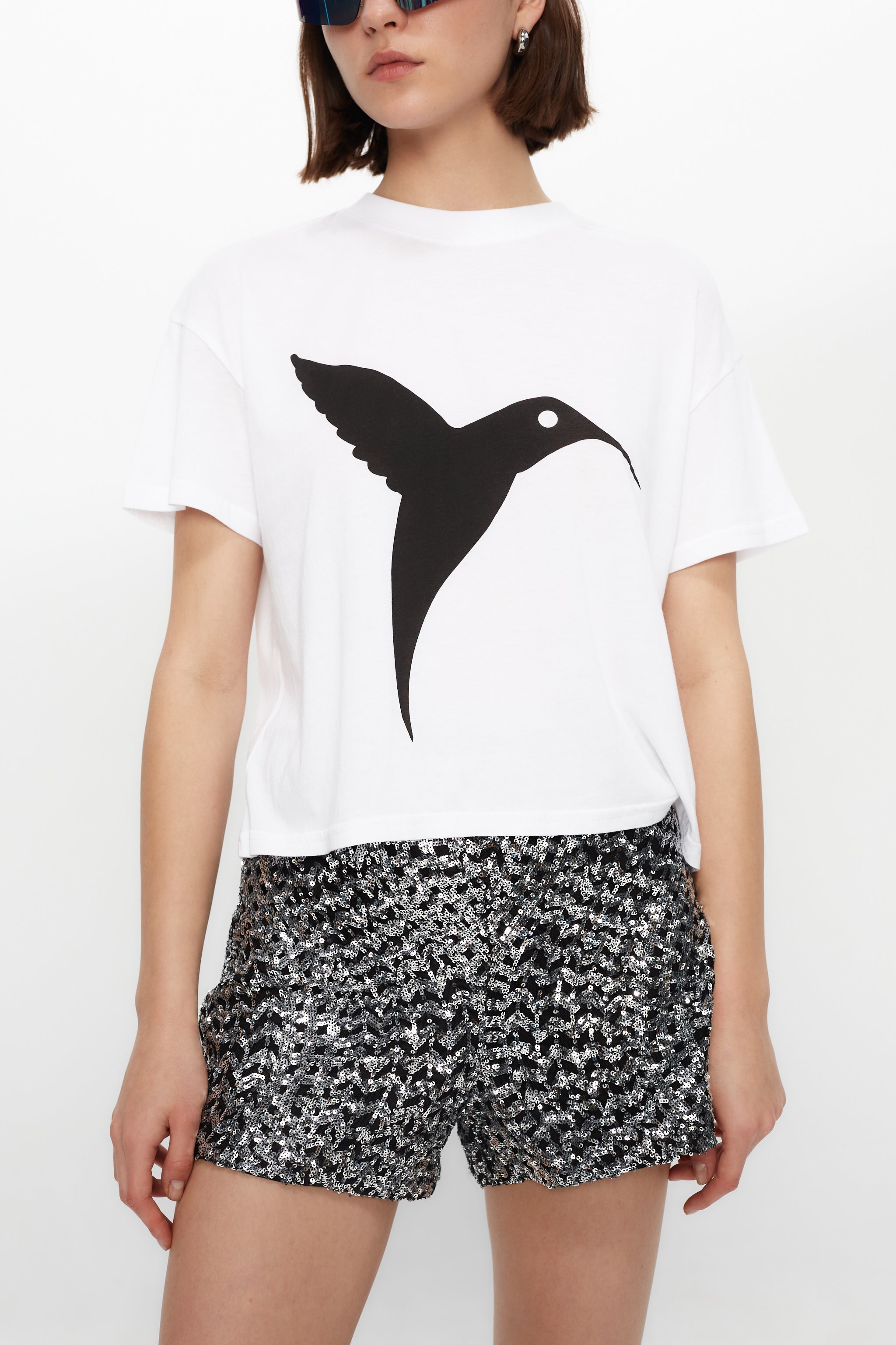 Classic white T-shirt with front & back print. Minimalist design for an effortless Ibiza look. Shop your summer essential now!