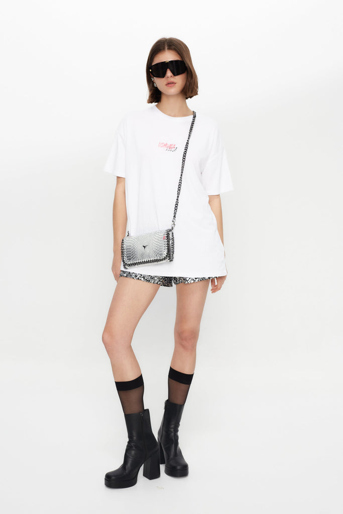 Oversized T-shirt with bold front & back print for a streetwear edge. Perfect for Ibiza summer vibes. Shop the look now!