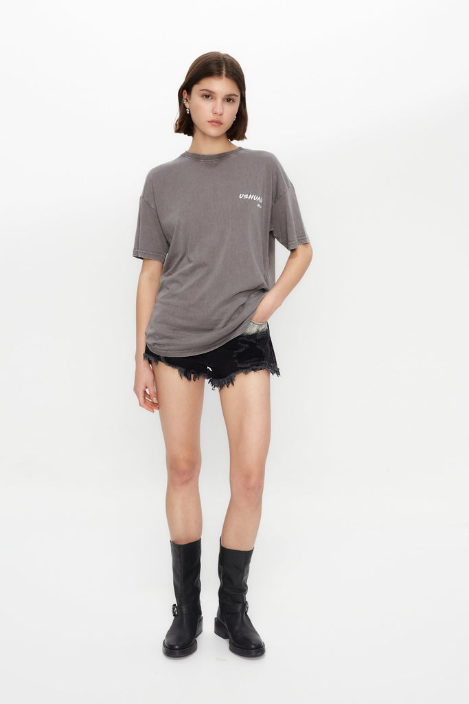 Oversized acid-wash T-shirt with bold front & back print. Perfect for streetwear lovers and Ibiza vibes. Shop the statement tee now!