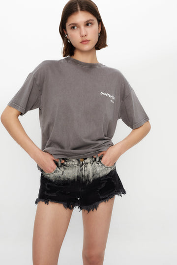 Acid wash denim shorts with jacquard back label and edgy fit. Perfect for summer festival vibes in Ibiza. Shop now!