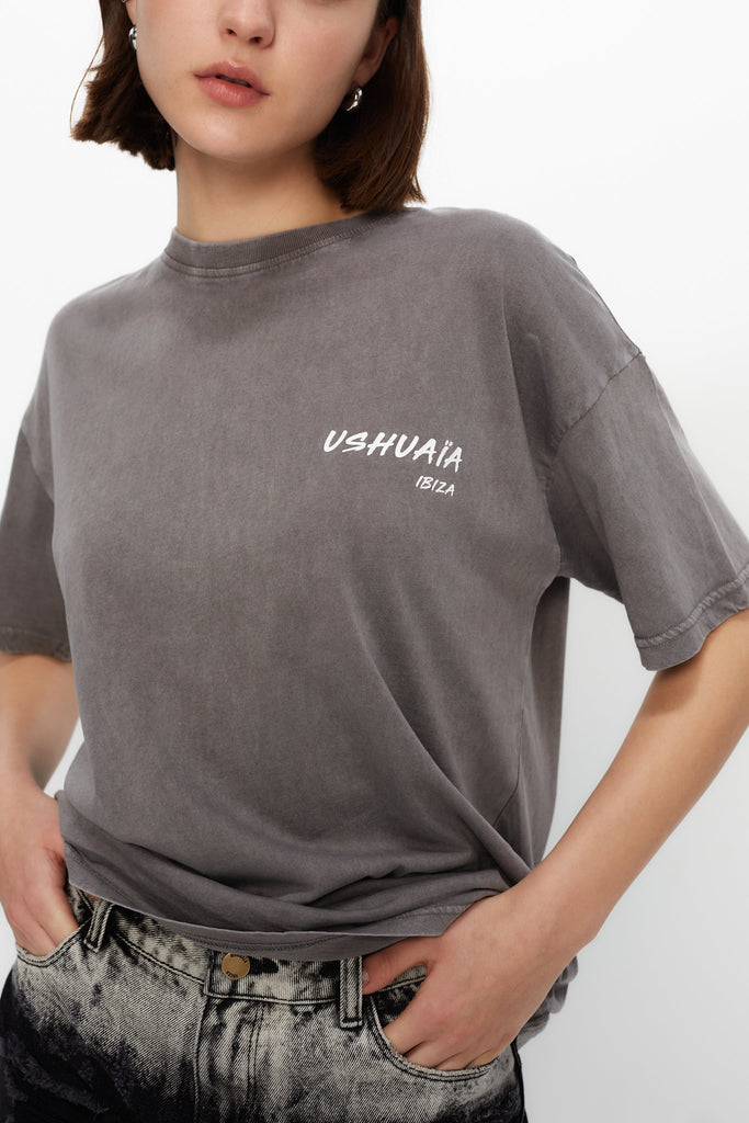 Oversized acid-wash T-shirt with bold front & back print. Perfect for streetwear lovers and Ibiza vibes. Shop the statement tee now!