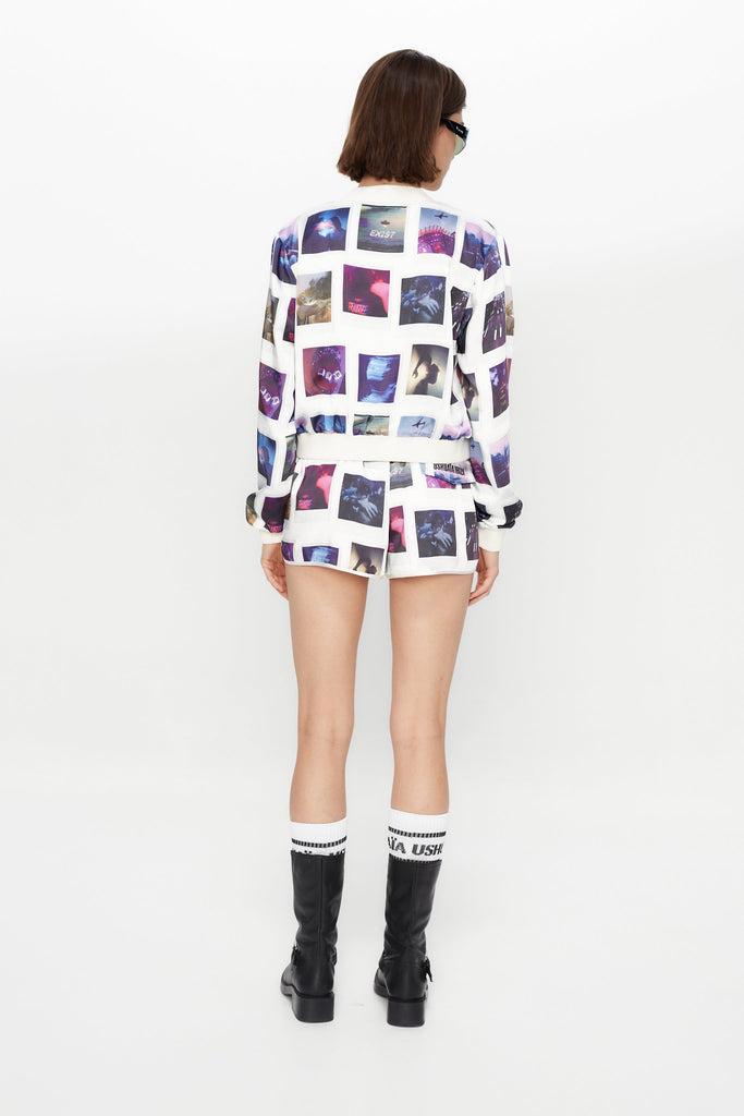 Printed surf-style shorts made of satin fabric. Adjustable waist with drawstring. Decorative flap pocket detail with embroidery on the back.
 