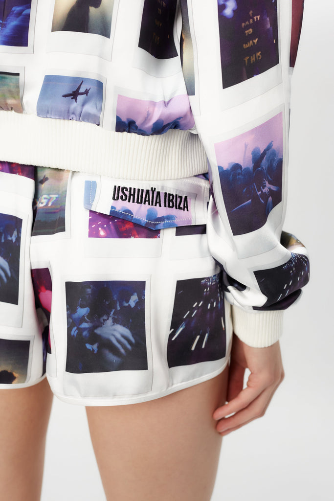 Printed surf-style shorts made of satin fabric. Adjustable waist with drawstring. Decorative flap pocket detail with embroidery on the back.
 