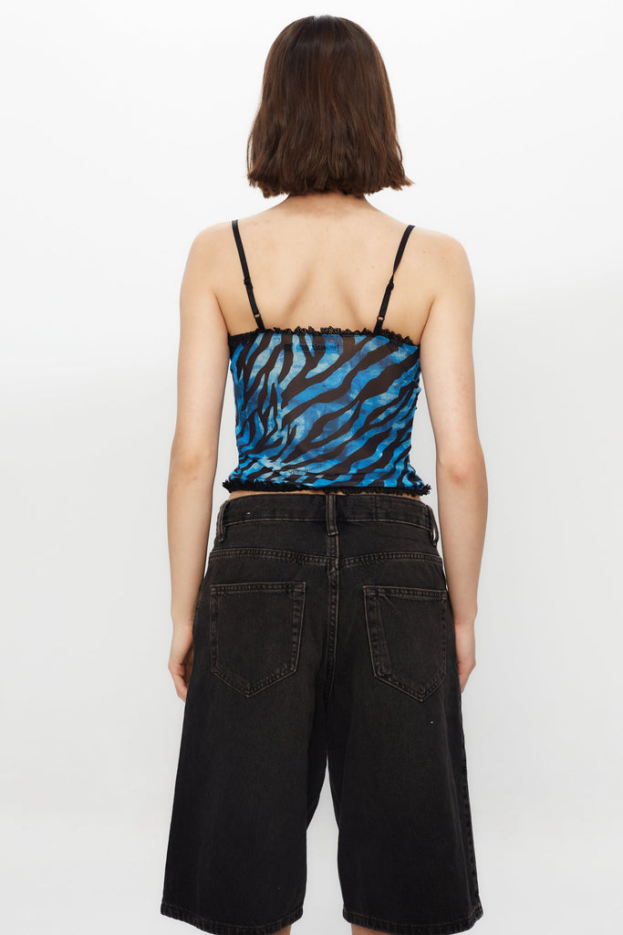 Printed tank top with corset cut and adjustable straps. Lace detail and bow with metallic ornament.