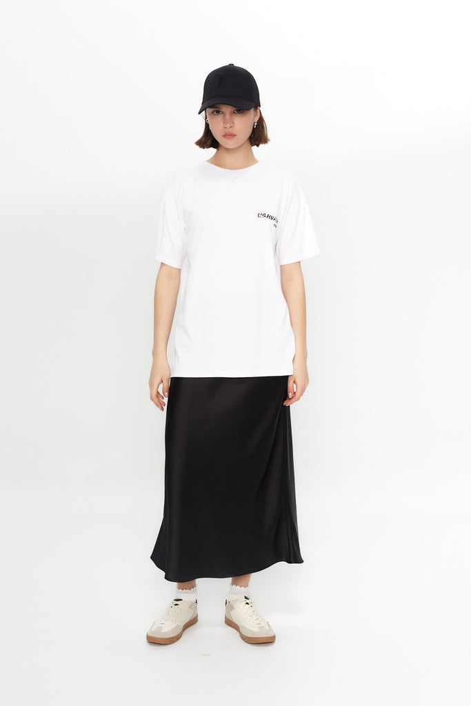 Oversized white T-shirt with bold Ibiza print front & back. Perfect for summer streetwear vibes. Shop the look now!