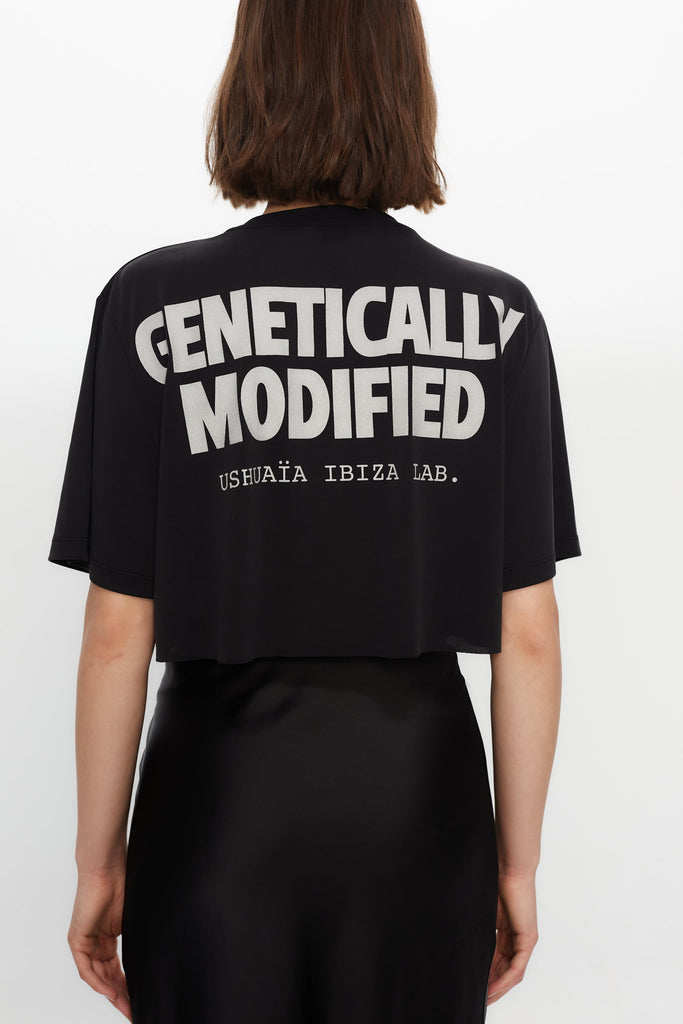 Black cropped T-shirt with metallic finish, bold front print & chain details. Perfect for edgy Ibiza vibes. Shop the trend now!