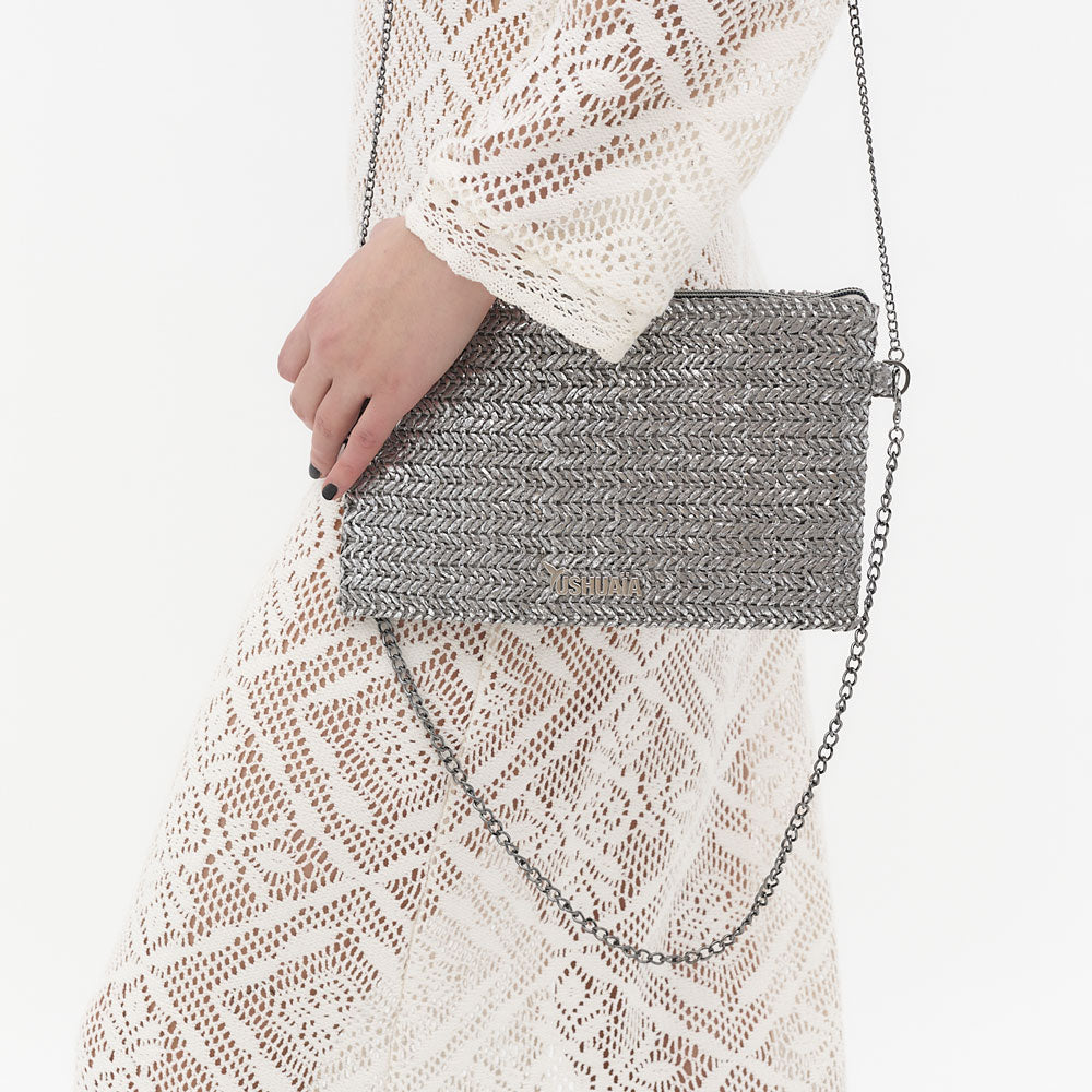 Bolso clutch dorado Ushuaïa Ibiza con cadena metálica desmontable.