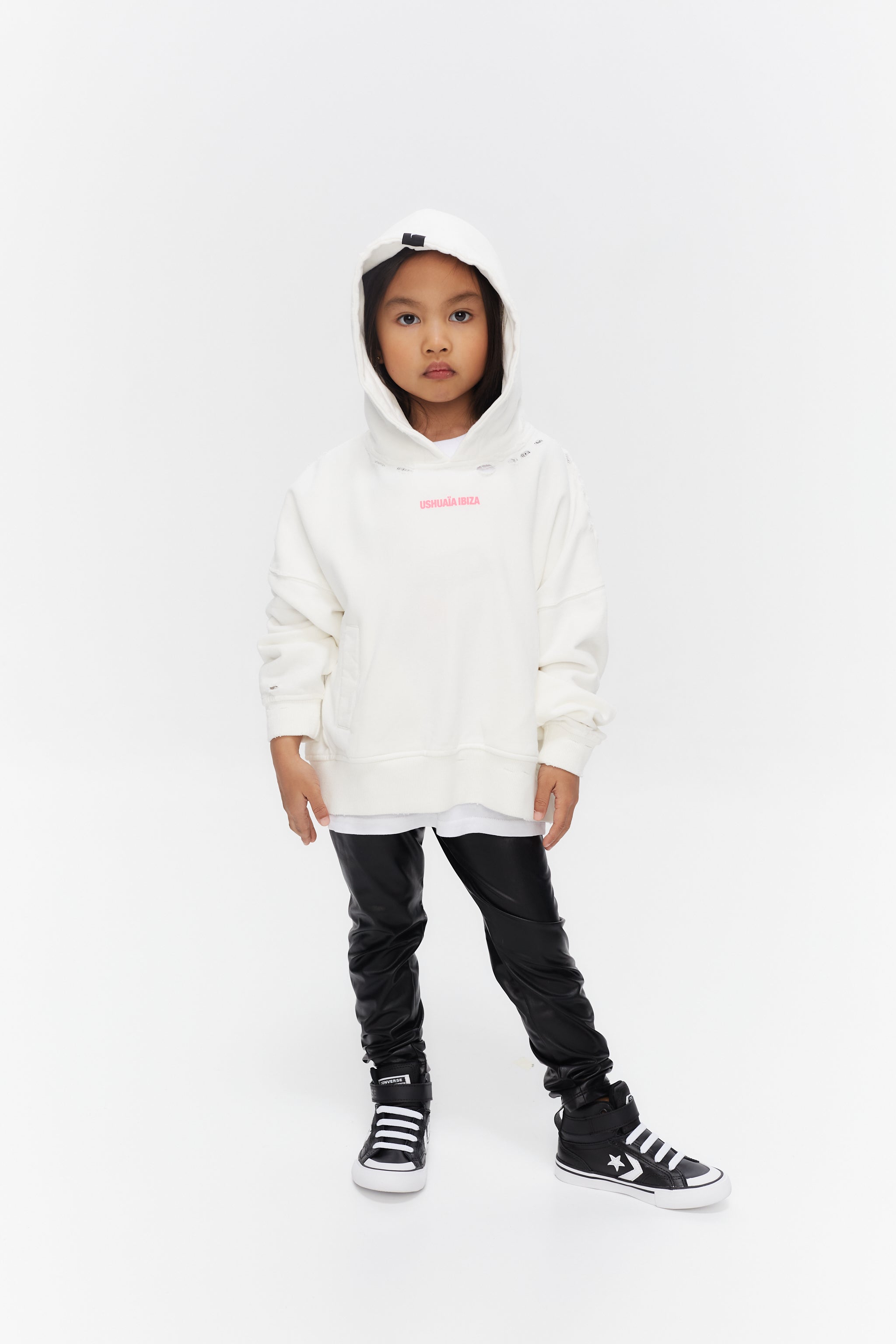 Oversized hoodie with long sleeves washed with peach effect. Contrast combined print detail on front and back. Front welt pockets. Wear and rubbing on cuffs and seams. 
 