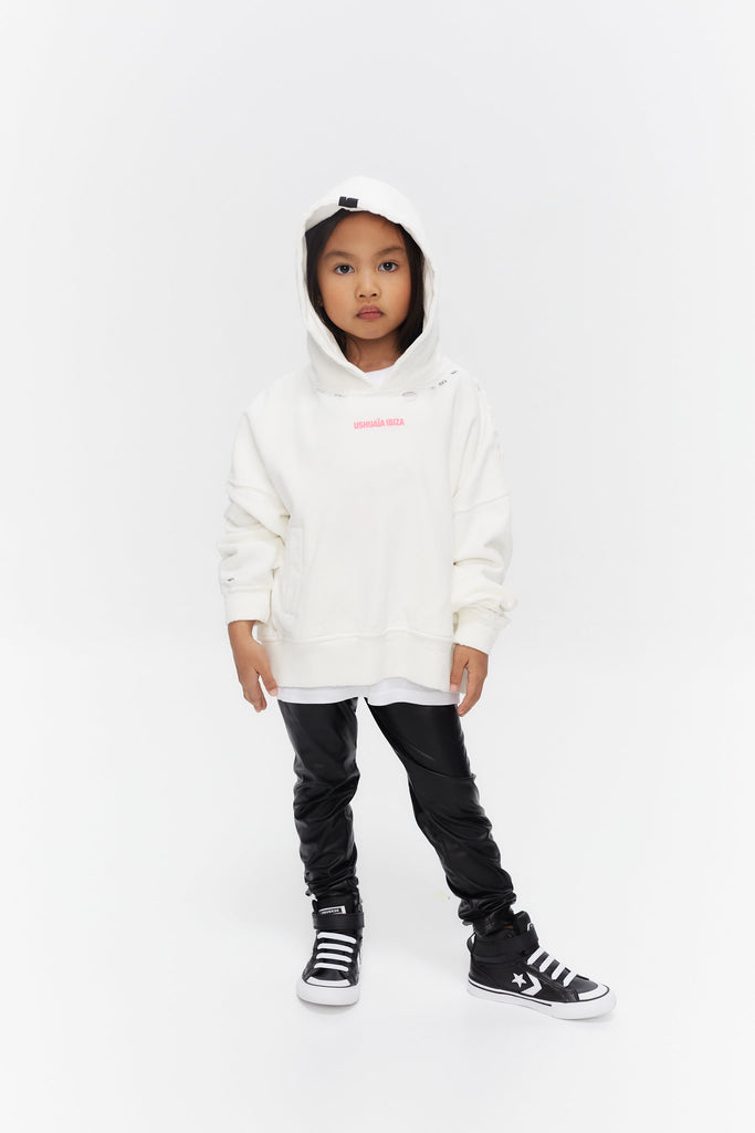 Oversized hoodie with long sleeves washed with peach effect. Contrast combined print detail on front and back. Front welt pockets. Wear and rubbing on cuffs and seams. 
 