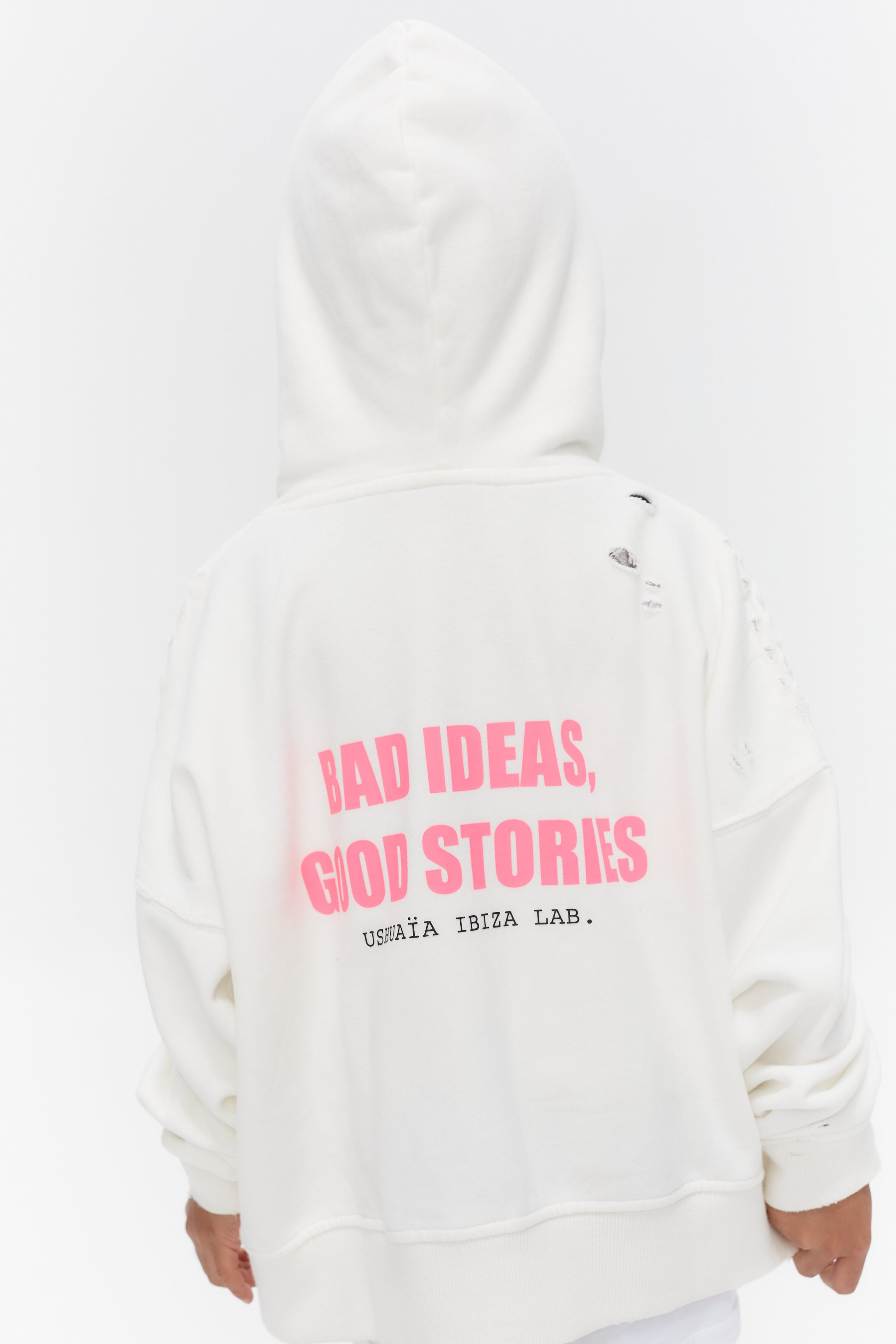 Oversized hoodie with long sleeves washed with peach effect. Contrast combined print detail on front and back. Front welt pockets. Wear and rubbing on cuffs and seams. 
 