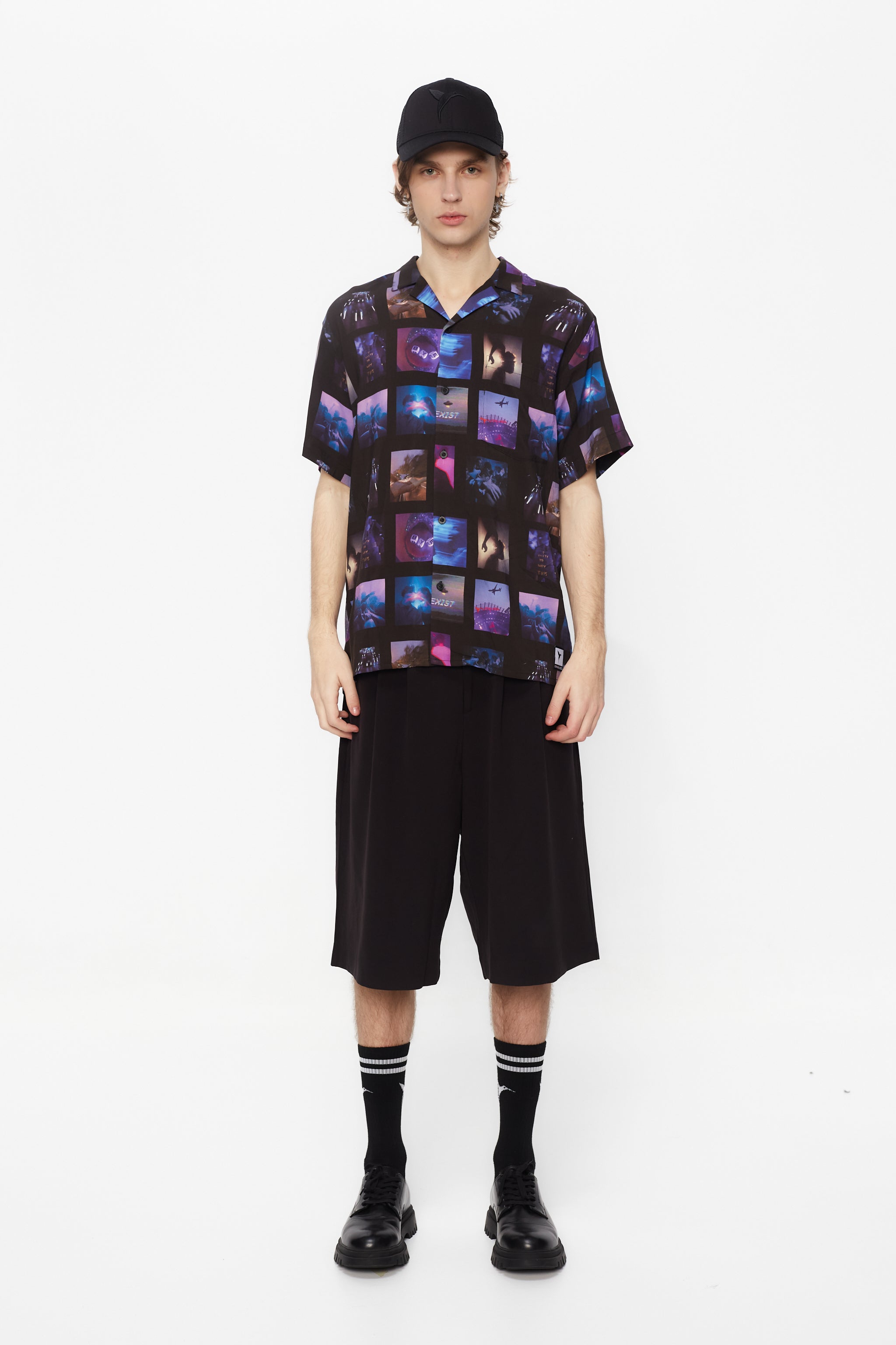 Printed shirt made of blend fabric. Lapel collar and short sleeve. Front button closure. Patch detail on the front and personalized label on the back.