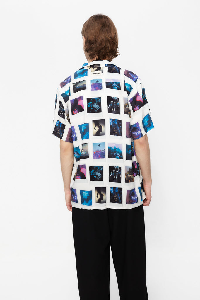 Printed shirt made of blend fabric. Lapel collar and short sleeve. Front button closure. Patch detail on the front and personalized label on the back.