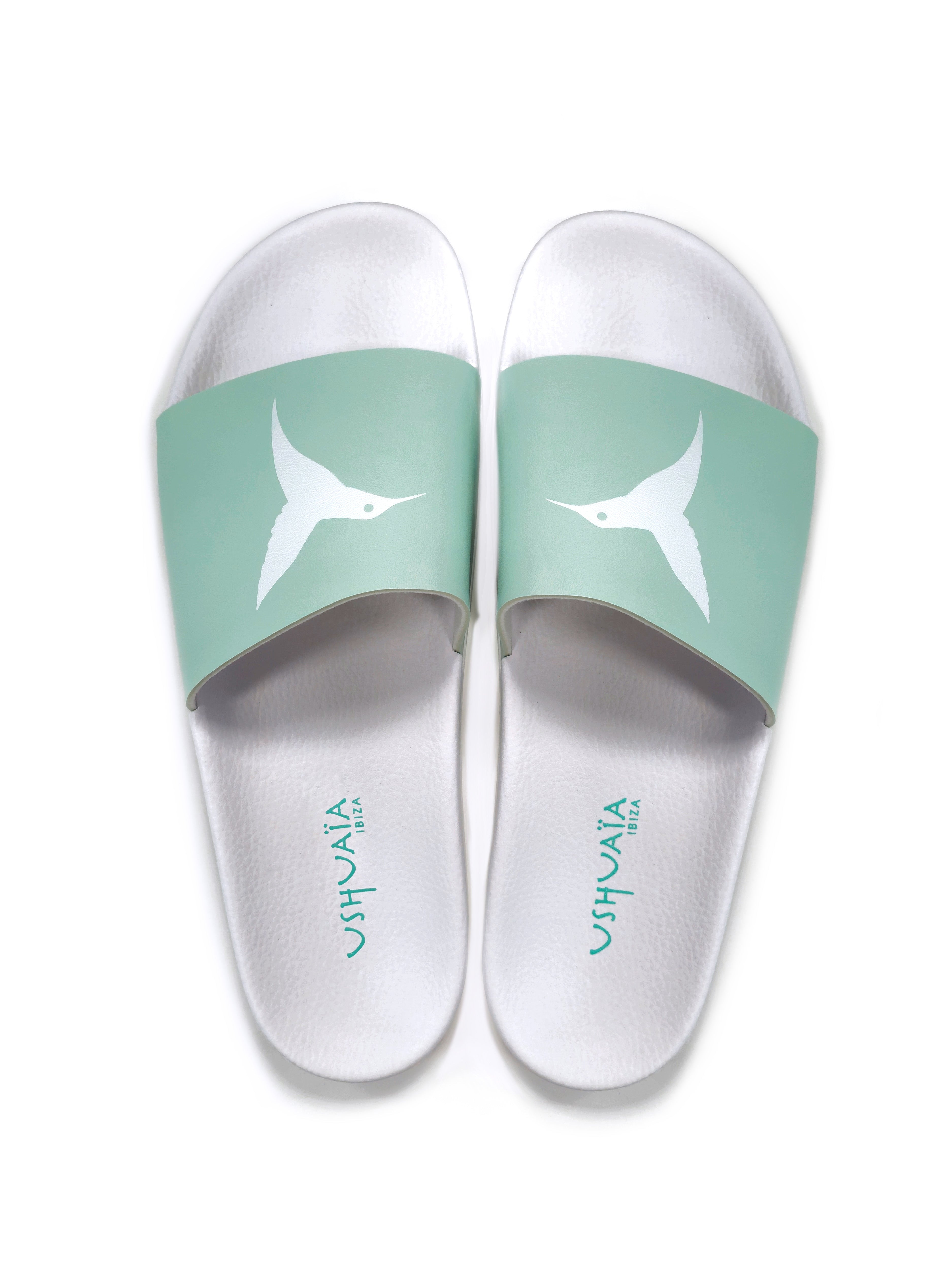 Turquoise flip-flops with white logo